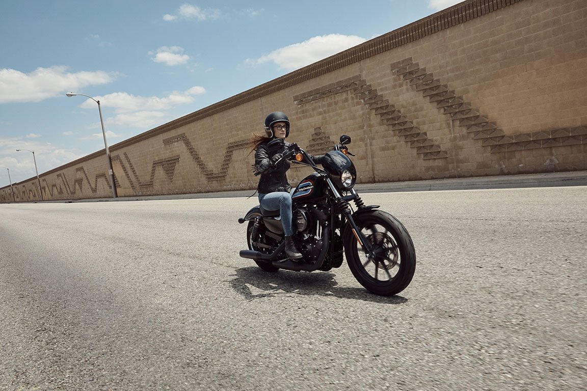 Beginner motorcyclist riding a harley-davidson sportster 1200 motorcycle